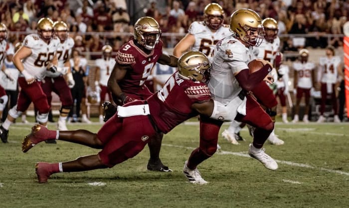 Florida State defensive tackle Dennis Briggs, Jr. (6) tackles Boston College quarterback Phil Jurkovec (5) inside Doak S. Campbell Stadium, Tallahassee, FL. September 24, 2022